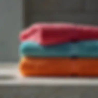 Close-up view of plush cotton bath towels showcasing their rich texture and vibrant colors.