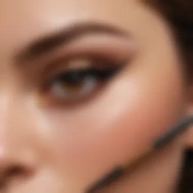 Elegant makeup brush applying brown sparkle eyeliner