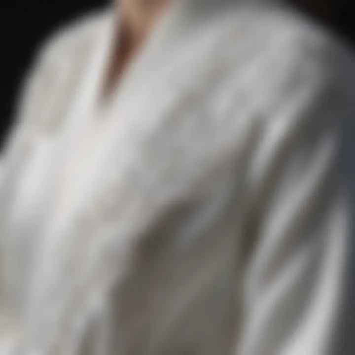 Close-up of intricate embroidery detail on a white company robe