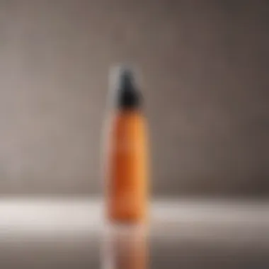 Close-up of a hair mist spray bottle against a natural background