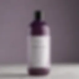 Close-up of Kristin Ess Hair Purple Shampoo bottle showcasing its unique design and branding.