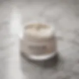 Luxurious skin tightening cream on a marble surface