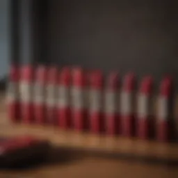 A variety of soft red lipstick shades displayed on a wooden table