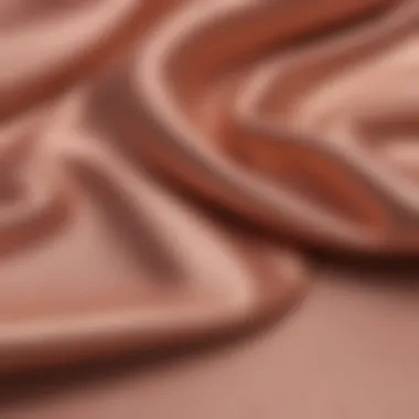 A close-up of Kera color rose gold fabric used in fashion design