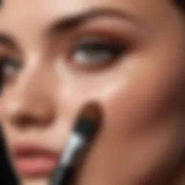 Demonstration of foundation application technique using a short foundation brush.