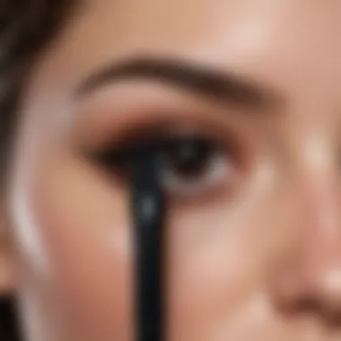 The Potency of Black Pigment Close-up of a mascara wand saturated with black pigment