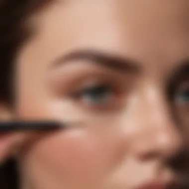 Professional makeup artist demonstrating eyebrow filler technique