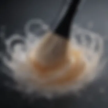 Makeup brush swirling in soapy water